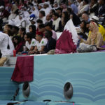 
              Fans sit on the stands above air conditioning ventilators during a World Cup group A soccer match between Qatar and Ecuador at the Al Bayt Stadium in Al Khor , Qatar, Sunday, Nov. 20, 2022. (AP Photo/Manu Fernandez)
            