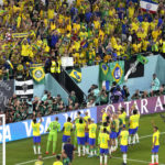 
              Brazil's players celebrate at the end of the World Cup group G soccer match between Brazil and Switzerland, at the Stadium 974 in Doha, Qatar, Monday, Nov. 28, 2022. (AP Photo/Darko Bandic)
            