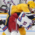 
              Nashville Predators' Jeremy Lauzon (3) and New York Rangers' Ryan Lindgren (55) fight in the second period of an NHL hockey game Saturday, Nov. 12, 2022, in Nashville, Tenn. (AP Photo/Mark Humphrey)
            