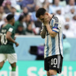 
              FILE - Argentina's Lionel Messi reacts disappointed during the World Cup group C soccer match between Argentina and Saudi Arabia at the Lusail Stadium in Lusail, Qatar, on Nov. 22, 2022. For a brief moment after Saudi Arabia's Salem Aldawsari fired a soccer ball from just inside the penalty box into the back of the net to seal a win against Argentina, Arabs across the divided Middle East found something to celebrate. (AP Photo/Natacha Pisarenko, File)
            