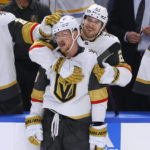 
              CORRECTS SCORE TO 7-4, INSTEAD OF 6-4 - Vegas Golden Knights center Jack Eichel (9) and center Brett Howden (21) celebrate the team's 7-4 victory over the Buffalo Sabres in an NHL hockey game, Thursday, Nov. 10, 2022, in Buffalo, N.Y. (AP Photo/Jeffrey T. Barnes)
            