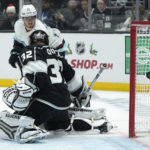 
              Seattle Kraken center Alex Wennberg, top, scores on Los Angeles Kings goaltender Jonathan Quick during the first period of an NHL hockey game Tuesday, Nov. 29, 2022, in Los Angeles. (AP Photo/Mark J. Terrill)
            