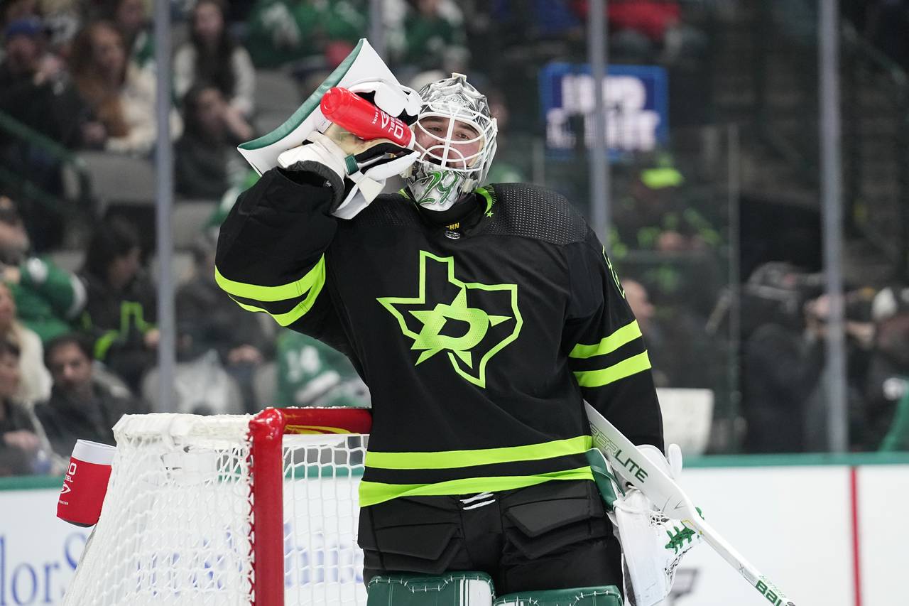 Dallas Stars goaltender Jake Oettinger takes a sip of water in the second period of an NHL hockey g...