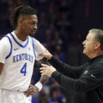 
              Kentucky's Daimion Collins (4) is instructed by head coach John Calipari during the second half of an NCAA college basketball game against South Carolina State in Lexington, Ky., Thursday, Nov. 17, 2022. (AP Photo/James Crisp)
            