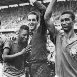 
              FILE - Brazil's 17-year-old Pele, left, weeps on the shoulder of goalkeeper Gilmar Dos Santos Neves, after Brazil's 5-2 victory over Sweden in the World Cup final soccer match, in Stockholm, Sweden on June 29, 1958. (AP Photo/File)
            