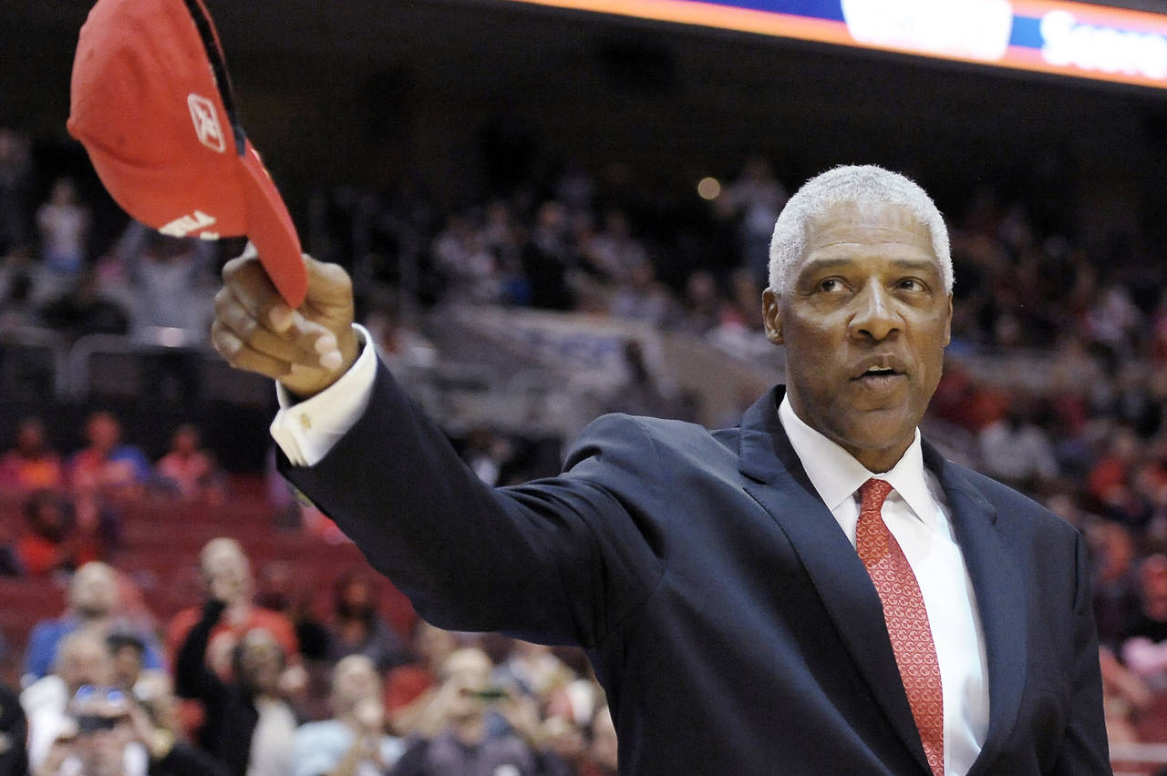 FILE - Basketball Hall of Famer Julius Erving tips his cap to the crowd as he takes the court durin...