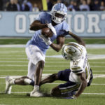 
              North Carolina defensive back Storm Duck (3) intercepts a pass intended for Georgia Tech wide receiver Malik Rutherford (12) during the first half of an NCAA college football game, Saturday, Nov. 19, 2022, in Chapel Hill, N.C. (AP Photo/Chris Seward)
            