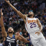 
              Phoenix Suns forward Mikal Bridges (25) goes to the basket past Minnesota Timberwolves forward Kyle Anderson (5) in the second quarter of an NBA basketball game Wednesday, Nov. 9, 2022, in Minneapolis. (AP Photo/Bruce Kluckhohn)
            