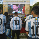 
              Argentina soccer fans wearing Lionel Messi jerseys watch their team lose to Saudi Arabia in a World Cup Group C soccer match, played on a large screen in the Palermo neighborhood of Buenos, Aires, Argentina, early Tuesday, Nov. 22, 2022. (AP Photo/Gustavo Garello)
            
