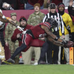 
              South Carolina tight end Jaheim Bell (0) dives for the end zone to score on a 19-yard reception during the first half of the team's NCAA college football game against Tennessee on Saturday, Nov. 19, 2022, in Columbia, S.C. (AP Photo/Artie Walker Jr.)
            