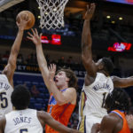 
              New Orleans Pelicans guard Trey Murphy III (25) blocks a shot by Oklahoma City Thunder guard Josh Giddey in the first quarter of an NBA basketball game in New Orleans, Monday, Nov. 28, 2022. (AP Photo/Derick Hingle)
            
