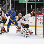 
              Anaheim Ducks goaltender John Gibson (36) eyes the puck against St. Louis Blues' Alexey Toropchenko (13) during the second period of an NHL hockey game, Saturday, Nov. 19, 2022, in St. Louis. (AP Photo/Jeff Le)
            
