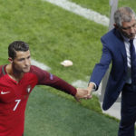 
              FILE - Portugal's Cristiano Ronaldo, left, greets Portugal coach Fernando Santos at the end of the Euro 2016 Group F soccer match between Portugal and Iceland at the Geoffroy Guichard stadium in Saint-Etienne, France, on June 14, 2016. The last 32-team World Cup will be the shortest  in this era. There are just 28 days from starting on Nov. 21 in Qatar to finishing on Dec. 18. And only 25 days to play seven games if a team from Groups G or H – like Brazil or Portugal – is to reach the final after opening on Nov. 24. (AP Photo/Michael Sohn, File)
            