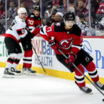 
              New Jersey Devils center Yegor Sharangovich (17) skates with the puck during the third period of the team's NHL hockey game against the Ottawa Senators, Thursday, Nov. 10, 2022, in Newark, N.J. The Devils won 4-3 in overtime. (AP Photo/Julia Nikhinson)
            