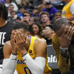 
              Los Angeles Lakers' Anthony Davis, left, Russell Westbrook (0) and LeBron James sit on the bench near the end of the fourth quarter of the team's NBA basketball game against the Utah Jazz on Monday, Nov. 7, 2022, in Salt Lake City. (AP Photo/Rick Bowmer)
            
