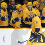 
              Nashville Predators' Cody Glass (8) is congratulated after scoring the winning goal in a shootout against the Arizona Coyotes in an NHL hockey game Monday, Nov. 21, 2022, in Nashville, Tenn. (AP Photo/Mark Humphrey)
            
