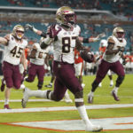 
              Florida State tight end Camren McDonald (87) celebrates after scoring a touchdown during the second half of an NCAA college football game against Miami, Saturday, Nov. 5, 2022, in Miami Gardens, Fla.(AP Photo/Lynne Sladky)
            