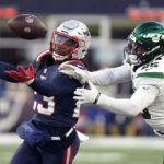
              New England Patriots safety Kyle Dugger, left, reaches for the ball against New York Jets running back Ty Johnson (25) during the second half of an NFL football game, Sunday, Nov. 20, 2022, in Foxborough, Mass. (AP Photo/Steven Senne)
            