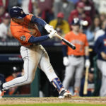 
              Houston Astros' Jeremy Pena hits a home run during the fourth inning in Game 5 of baseball's World Series between the Houston Astros and the Philadelphia Phillies on Thursday, Nov. 3, 2022, in Philadelphia. (AP Photo/David J. Phillip)
            