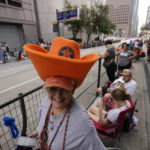 
              Diana Rodriguez waits for a victory parade for the Houston Astros' World Series baseball championship Monday, Nov. 7, 2022, in Houston. (AP Photo/David Phillip)
            