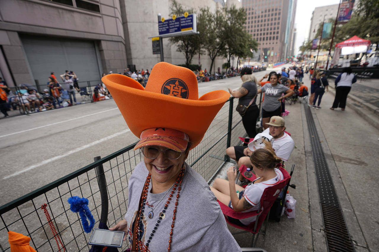 Diana Rodriguez waits for a victory parade for the Houston Astros' World Series baseball championsh...