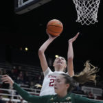 
              Stanford forward Cameron Brink (22) shoots over Cal Poly forward Natalia Ackerman (35) during the first half of an NCAA college basketball game in Stanford, Calif., Wednesday, Nov. 16, 2022. (AP Photo/Godofredo A. Vásquez)
            