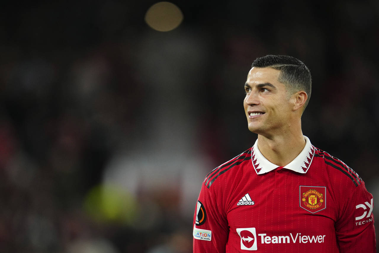 Manchester United's Cristiano Ronaldo smiles before the start of the Europa League group E soccer m...