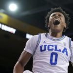 
              UCLA guard Jaylen Clark (0) celebrates after dunking against Sacramento State during the second half of an NCAA college basketball game Monday, Nov. 7, 2022, in Los Angeles. (AP Photo/Marcio Jose Sanchez)
            