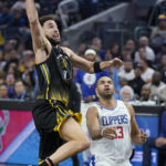 
              Golden State Warriors guard Klay Thompson (11) dunks in front of Los Angeles Clippers forward Nicolas Batum (33) during the first half of an NBA basketball game in San Francisco, Wednesday, Nov. 23, 2022. (AP Photo/Jeff Chiu)
            