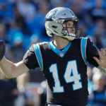 
              Carolina Panthers quarterback Sam Darnold passes during the first half of an NFL football game between the Carolina Panthers and the Denver Broncos on Sunday, Nov. 27, 2022, in Charlotte, N.C. (AP Photo/Rusty Jones)
            