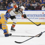 
              Anaheim Ducks' Cam Fowler shoots the puck against the St. Louis Blues during the first period of an NHL hockey game, Monday, Nov. 21, 2022, in St. Louis. (AP Photo/Michael Thomas)
            