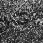 
              FILE - Michigan fans pour onto the field, bringing down a goal post after Michigan defeated top-ranked Ohio State 24-12 in Ann Arbor, Mich., Nov. 22, 1969. In Bo Schembechler’s first game against Woody Hayes, No. 12 Michigan beat the top-ranked Buckeyes 24-12 at home. (AP Photo, File)
            