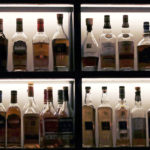 
              FILE - A vast array of single malt scotch bottles are displayed at Wink & Nod, basement-dwelling, speakeasy-like bar, in Boston, on Dec. 10, 2019. In Massachusetts, Democrats and Republicans could find an issue to agree on: letting bars have happy hours. Commonwealth law bans bars and other establishments from having special discounts on beer, wine and liquor. AP VoteCast shows a majority of voters favor the state legalizing happy hour. (AP Photo/Charles Krupa, File)
            