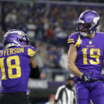 
              Minnesota Vikings wide receiver Adam Thielen (19) celebrates with teammate wide receiver Justin Jefferson (18) after catching a 15-yard touchdown pass during the second half of an NFL football game against the New England Patriots, Thursday, Nov. 24, 2022, in Minneapolis. (AP Photo/Andy Clayton-King)
            