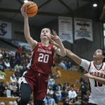 
              Stanford guard Elena Bosgana (20) shoots a layup next to Pacific guard Sydney Ward (10) during the second half of an NCAA college basketball game in Stockton, Calif., Friday, Nov. 11, 2022. (AP Photo/Godofredo A. Vásquez)
            