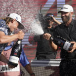
              Cameron Smith, left, and Dustin Johnson, right,  celebrate after the final round of the LIV Golf Team Championship at Trump National Doral Golf Club, Sunday, Oct. 30, 2022, in Doral, Fla. Johnson's 4 Aces GC team won the team championship. (AP Photo/Lynne Sladky)
            