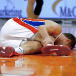 
              Detroit Pistons' Bojan Bogdanovic grabs his leg after falling to the court during the second half of the team's NBA basketball game against the Phoenix Suns in Phoenix, Friday, Nov. 25, 2022. (AP Photo/Darryl Webb)
            