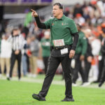 
              Miami head coach Mario Cristobal looks on in the first half of an NCAA college football game against Clemson on Saturday, Nov. 19, 2022, in Clemson, S.C. (AP Photo/Jacob Kupferman)
            