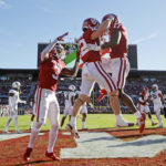 
              From left, Oklahoma wide receivers Jalil Farooq, Drake Stoops and Marvin Mims celebrate a touchdown by Stoops against Baylor in the second half of an NCAA college football game, Saturday, Nov. 5, 2022, in Norman, Okla. (AP Photo/Nate Billings)
            