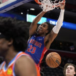 
              Detroit Pistons guard Jaden Ivey (23) dunks during the second half of an NBA basketball game against the Oklahoma City Thunder, Monday, Nov. 7, 2022, in Detroit. (AP Photo/Carlos Osorio)
            