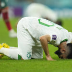 
              Saudi Arabia's Abdulrahman Al-Aboud kneels after losing 2-1 in the World Cup group C soccer match between Saudi Arabia and Mexico, at the Lusail Stadium in Lusail, Qatar, Wednesday, Nov. 30, 2022. (AP Photo/Julio Cortez)
            