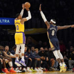 
              Los Angeles Lakers guard Russell Westbrook, left, shoots as New Orleans Pelicans forward Naji Marshall defends during the first half of an NBA basketball game Wednesday, Nov. 2, 2022, in Los Angeles. (AP Photo/Mark J. Terrill)
            