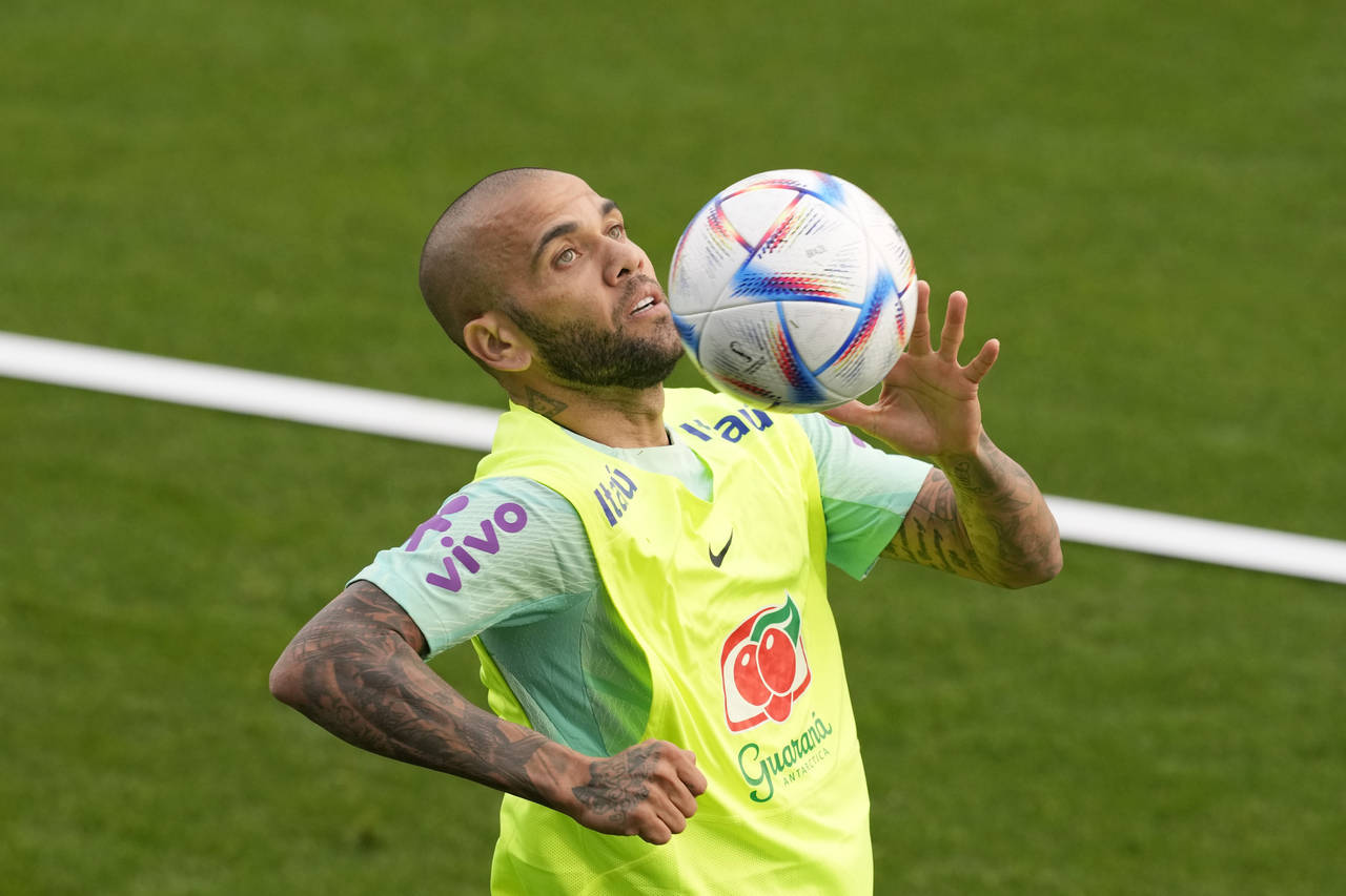 Brazil's Dani Alves controls the ball during a training session at the Continassa sporting center, ...