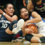 
              Duke guard Vanessa de Jesus, right, battles for the ball against Connecticut's Nika Muhl (10) during the first half of an NCAA college basketball game in the Phil Knight Legacy tournament Friday, Nov. 25, 2022, in Portland, Ore. (AP Photo/Rick Bowmer)
            