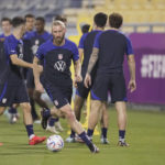 
              United States defender Tim Ream, center, and other players participate in an official training session at Al-Gharafa SC Stadium, in Doha, Saturday, Nov. 19, 2022. (AP Photo/Ashley Landis)
            