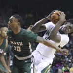 
              Baylor forward Josh Ojianwuna (15) pulls down a rebound while being defended by Mississippi Valley State guard Danny Washington (10) in the second half of an NCAA college basketball game, Monday, Nov. 7, 2022, in Waco, Texas. Baylor won 117-53. (AP Photo/Rod Aydelotte)
            