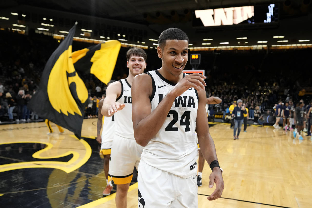Iowa forward Kris Murray (24) walks off the court after an NCAA college basketball game against Geo...