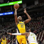 
              Indiana Pacers' Myles Turner (33) shoots as Houston Rockets' Jabari Smith Jr. (1) defends during the first half of an NBA basketball game Friday, Nov. 18, 2022, in Houston. (AP Photo/David J. Phillip)
            
