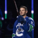 
              Former Vancouver Canucks player Kevin Bieksa is honored before the team's NHL hockey game against the Anaheim Ducks on Thursday, Nov. 3, 2022, in Vancouver, British Columbia. Bieksa signed a one-day contract with the Canucks to officially retire. (Ben Nelms/The Canadian Press via AP)
            