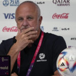 
              Australia's head coach Graham Arnold listens to a reporter during a press conference on the eve of the group D World Cup soccer match between France and Australia, in Doha, Qatar, Monday, Nov. 21, 2022. (AP Photo/Ariel Schalit)
            
